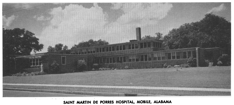 A mid-century style two story building labeled St. Martin de Porres Hospital.